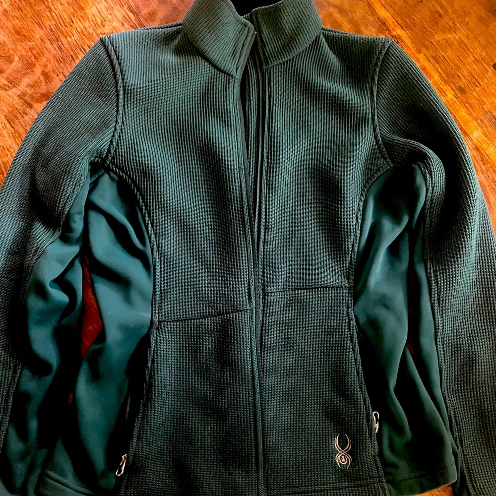 Green jacket, zipper pockets. No rips or stains.